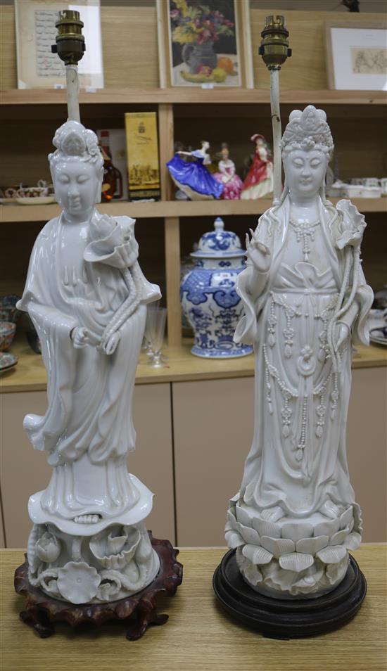 A pair of Chinese blanc de chine figural lamps on bases overall height 73cm